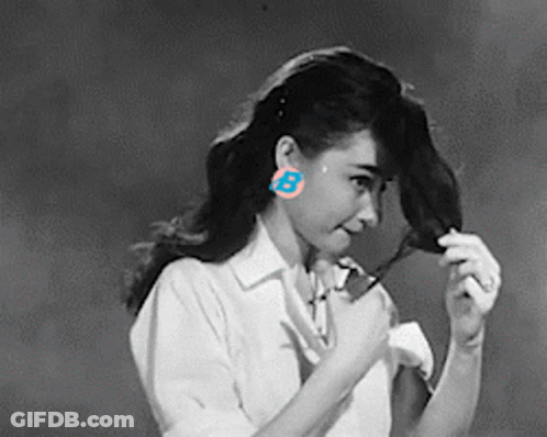 Woman Wearing Earrings With Letter B GIF