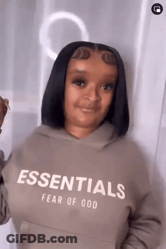 Woman Wearing Fear Of God Essentials Hoodie GIF