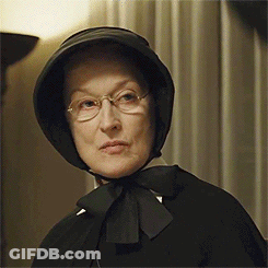 Woman Wearing Glasses And Black Bow Hat GIF