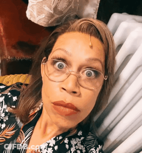 Woman Wearing Glasses And Floral Shirt GIF