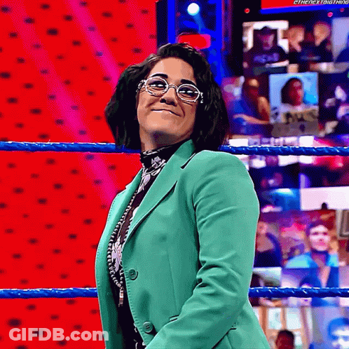 Woman Wearing Glasses And Green Jacket In Wrestling Ring GIF