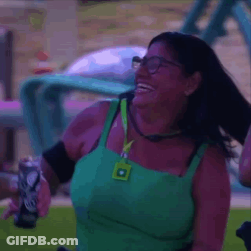 Woman Wearing Glasses And Green Tank Top Laughing Holding Soda GIF
