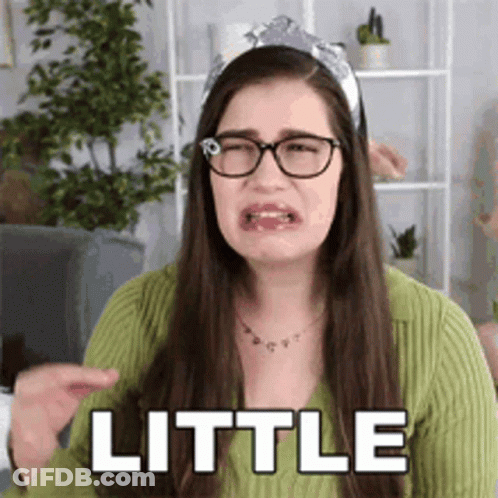 Woman Wearing Glasses And Headband Making Funny Face GIF
