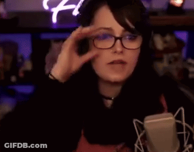 Woman Wearing Glasses And Headphones Pointing GIF