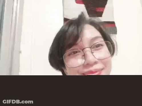 Woman Wearing Glasses And Headphones Smiling GIF