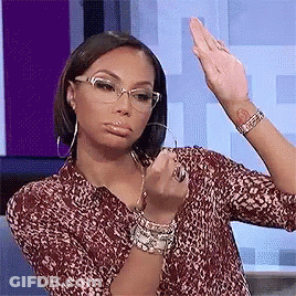 Woman Wearing Glasses And Leopard Shirt Making Funny Face GIF
