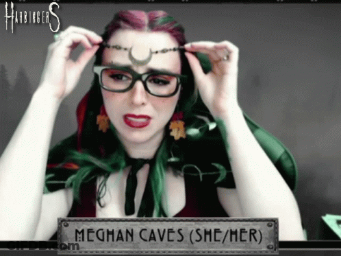 Woman Wearing Glasses And Meghan Caves Sign GIF