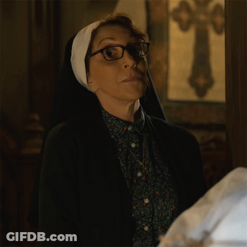 Woman Wearing Glasses And Nun's Veil GIF