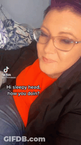 Woman Wearing Glasses And Orange Shirt GIF