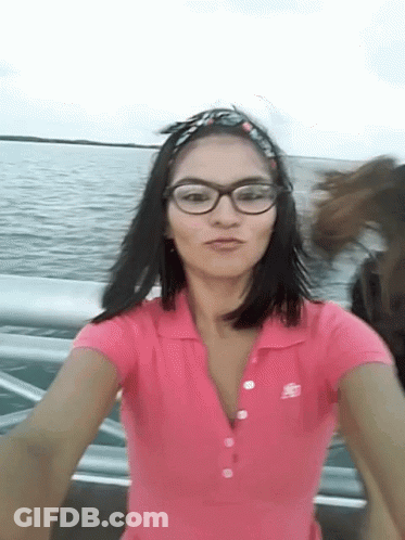 Woman Wearing Glasses And Pink Abercrombie Shirt GIF