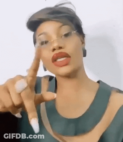 Woman Wearing Glasses And Red Lipstick Pointing GIF