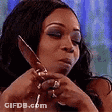 Woman Wearing Glasses And Red Lipstick Pointing GIF