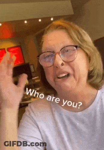 Woman Wearing Glasses Asking Who Are You GIF