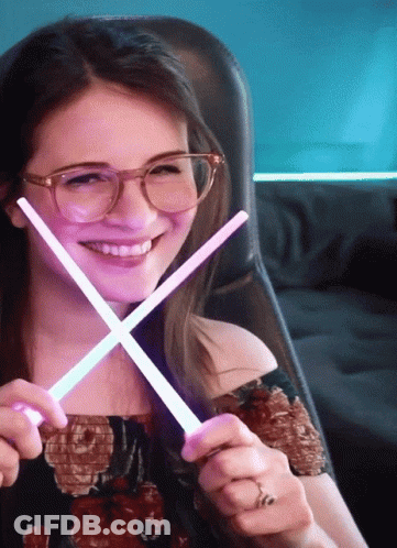 Woman Wearing Glasses Holding Glow Sticks GIF