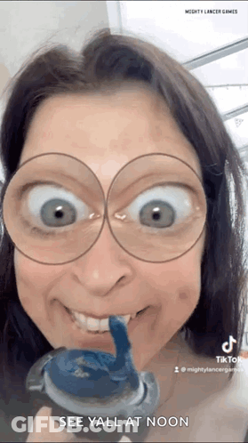 Woman Wearing Glasses Holding Toothpaste GIF