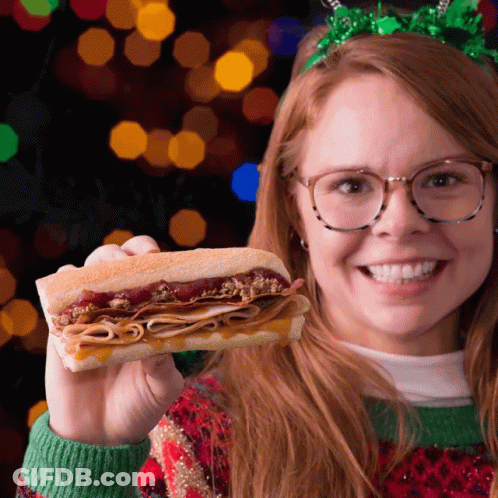 Woman Wearing Glasses Holding Turkey Sub GIF