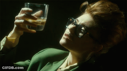 Woman Wearing Glasses Holding Water GIF