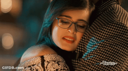 Woman Wearing Glasses Hugged By Man With Torce GIF