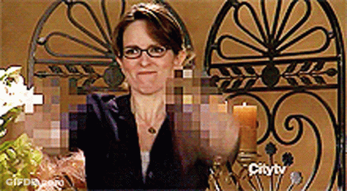 Woman Wearing Glasses In Front Of Fence GIF