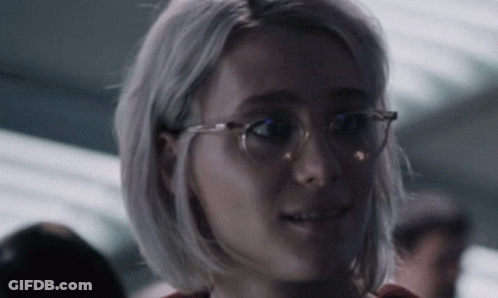 Woman Wearing Glasses Looking At Camera GIF