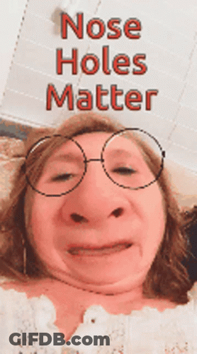 Woman Wearing Glasses Making Funny Face GIF