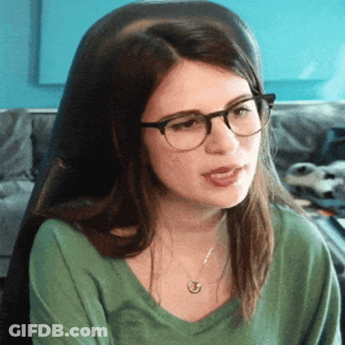 Woman Wearing Glasses Sitting With Mouth Open GIF