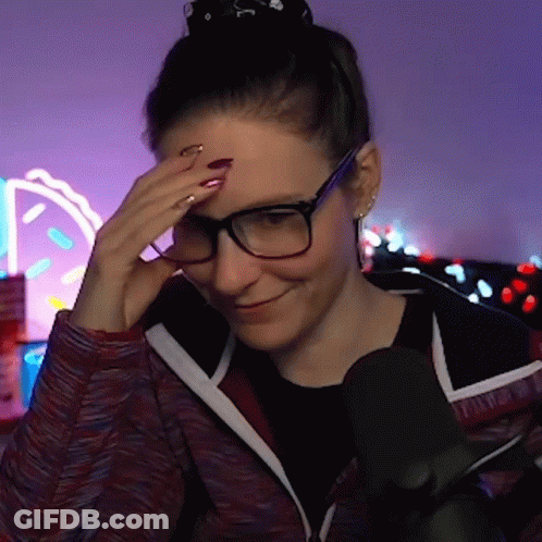 Woman Wearing Glasses Smiling And Holding Forehead GIF