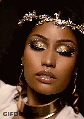 Woman Wearing Gold Crown And Earrings GIF