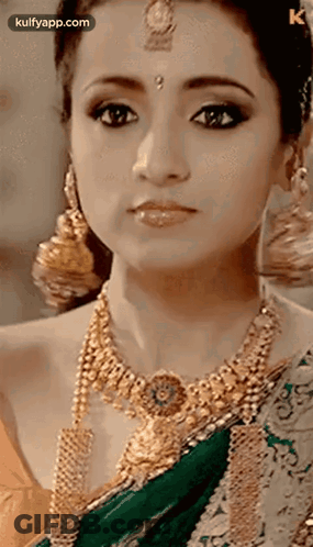 Woman Wearing Gold Jewelry And Green Saree GIF