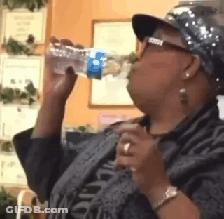 Woman Wearing Hat And Glasses Drinking Water GIF