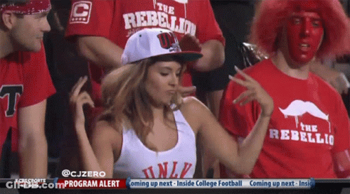 Woman Wearing Hat Saying The Rebellion Dancing In Crowd GIF