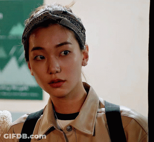 Woman Wearing Headband And Leather Jacket GIF