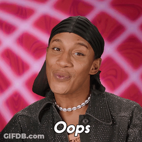Woman Wearing Headband And Oops Necklace GIF