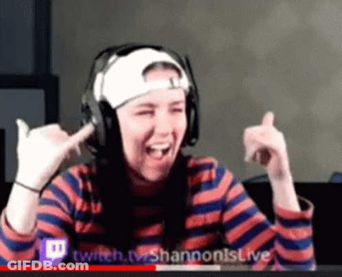 Woman Wearing Headphones And Hat Making Funny Face GIF