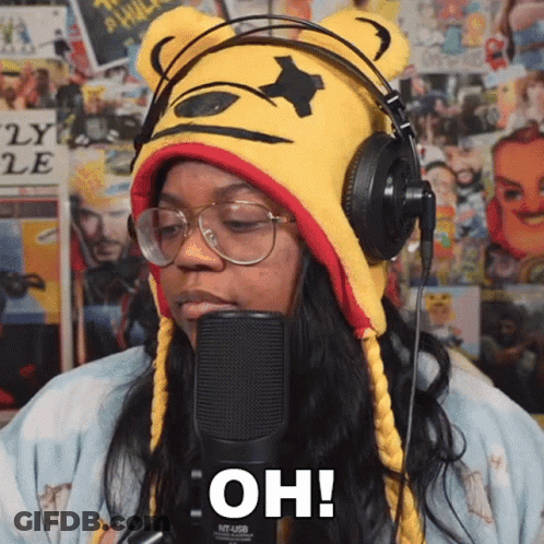 Woman Wearing Headphones And Winnie The Pooh Hat Says Oh GIF