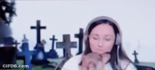 Woman Wearing Headphones Holding Puppy GIF