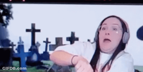Woman Wearing Headphones In Cemetery GIF