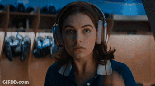 Woman Wearing Headphones Looking At Camera GIF