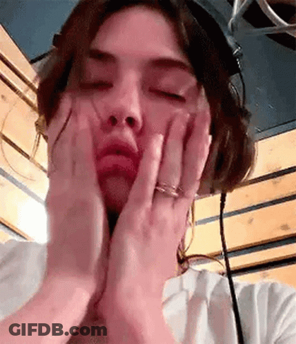 Woman Wearing Headphones Making Face GIF