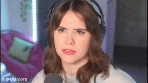 Woman Wearing Headphones Making Funny Face GIF