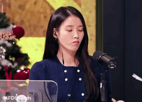 Woman Wearing Headphones Making Funny Face GIF