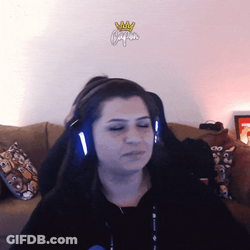 Woman Wearing Headphones Saying Capon GIF