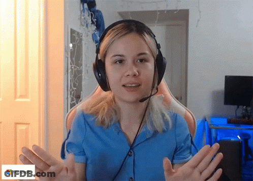 Woman Wearing Headphones Sitting Beside Microsoft Sign GIF