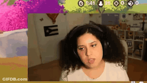 Woman Wearing Headphones Sitting In Front Of Screen GIF