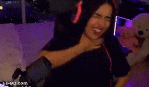 Woman Wearing Headphones Sitting On Couch GIF