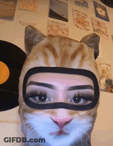Woman Wearing Heart Mask GIF