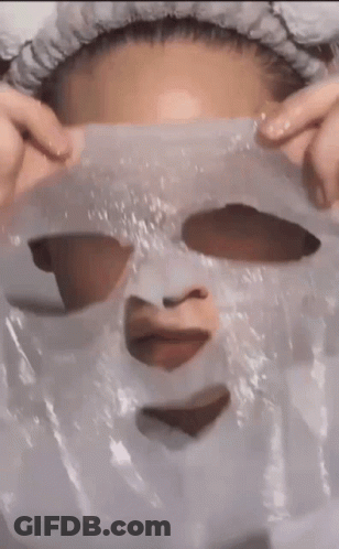 Woman Wearing Heart Mask GIF