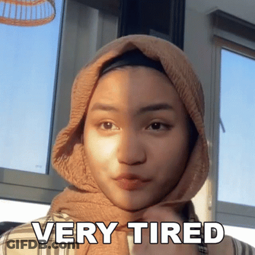 Woman Wearing Hijab Looking Very Tired GIF