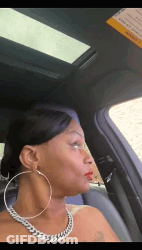 Woman Wearing Hoop Earrings And Necklace GIF