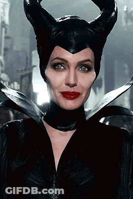 Woman Wearing Horned Black Hat And Red Lips GIF